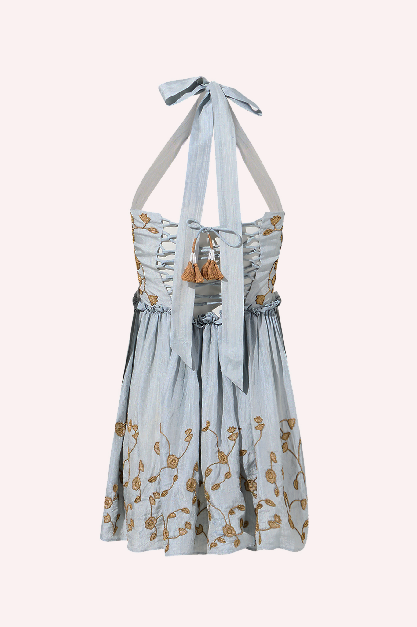 ZAZI Aarohi Dress in Cloud Petal, a luxury artisan-made gown crafted from naturally dyed handwoven Kosha silk with handcrafted zardozi embroidery. Features a halter neckline, adjustable corset lace-up back, and a flowing short skirt. Ethically made in India by Kumbaya artisans.
