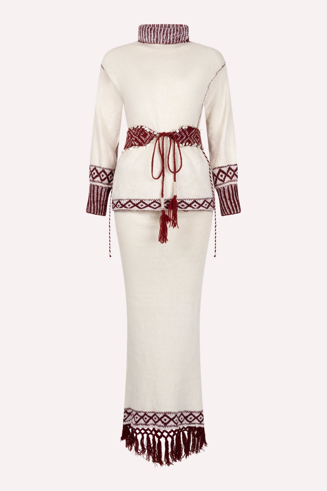 Ivory white knitted two-piece dress set with red and brown woven patterns and tassel hem.