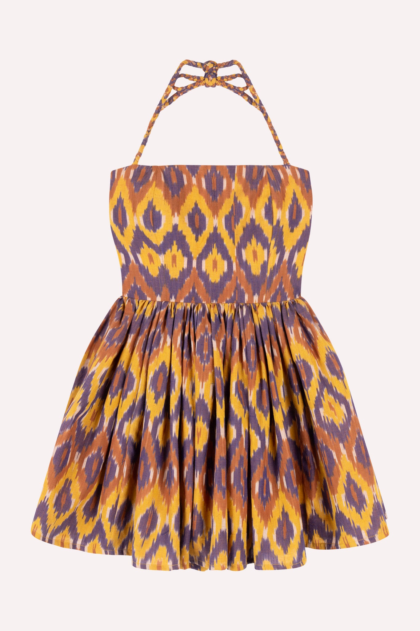A sleeveless knee-length dress with geometric Ikat pattern, spaghetti straps, and a fitted bodice.