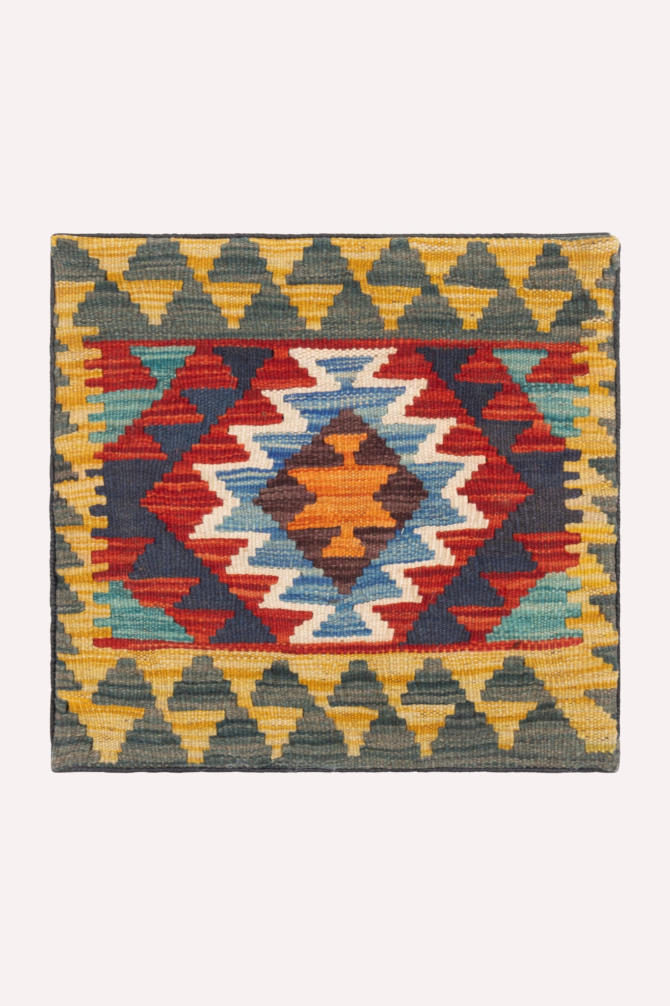 One-of-a-kind handwoven tribal kilim cushion cover, 44 × 42 cm, featuring traditional artisan weaving, subtle signs of age, and rich cultural heritage, curated by ZAZI.