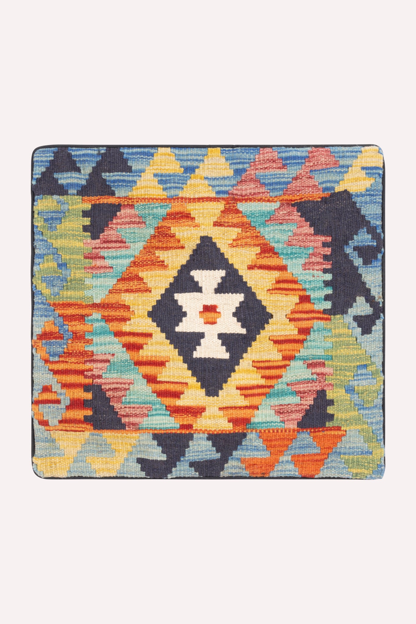 One-of-a-kind handwoven tribal kilim cushion cover, 46 × 46 cm, featuring traditional artisan weaving, subtle signs of age, and rich cultural heritage, curated by ZAZI.