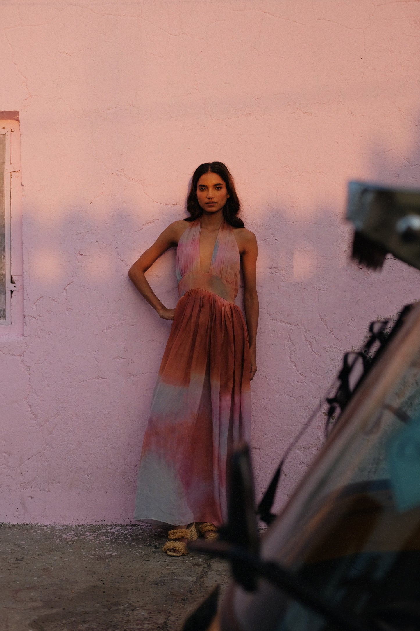 
                  
                    ZAZI Holiya hand-dyed maxi dress with halter neckline, flowing silhouette, and sunset-inspired watercolor hues, handcrafted in India by Heenaagrima artisans.
                  
                