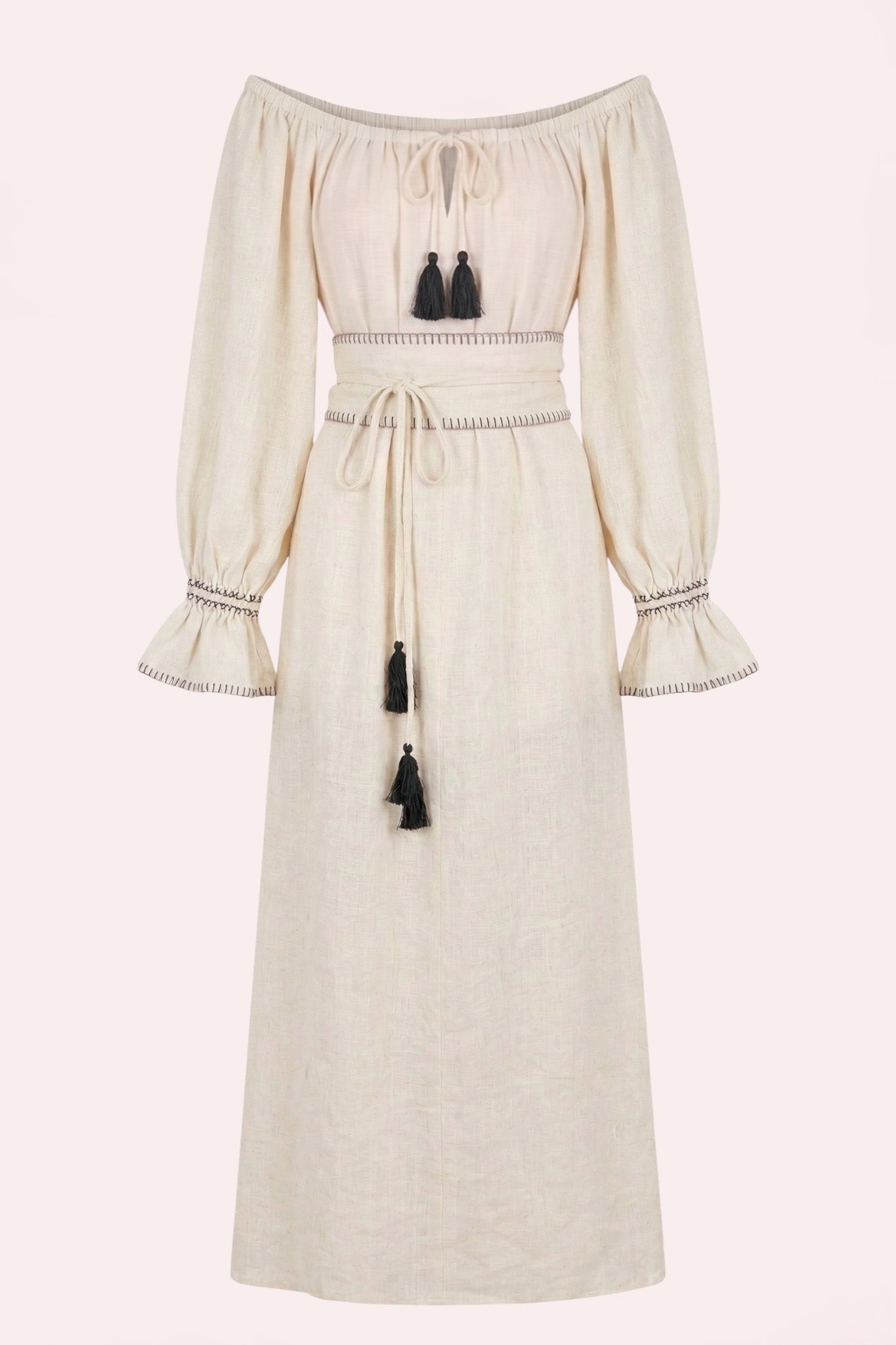 ZAZI Vayana Dress in handwoven Khadi cotton featuring a bohemian maxi silhouette, hand-embroidered details, versatile off-shoulder neckline, long sleeves, and matching belt.