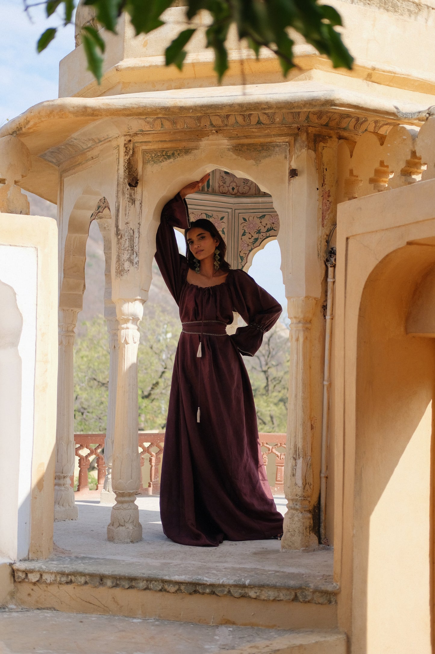 
                  
                    ZAZI Vayana Dress in handwoven Mulberry silk featuring a bohemian maxi silhouette, hand-embroidered details, versatile off-shoulder neckline, long sleeves, and matching belt.
                  
                