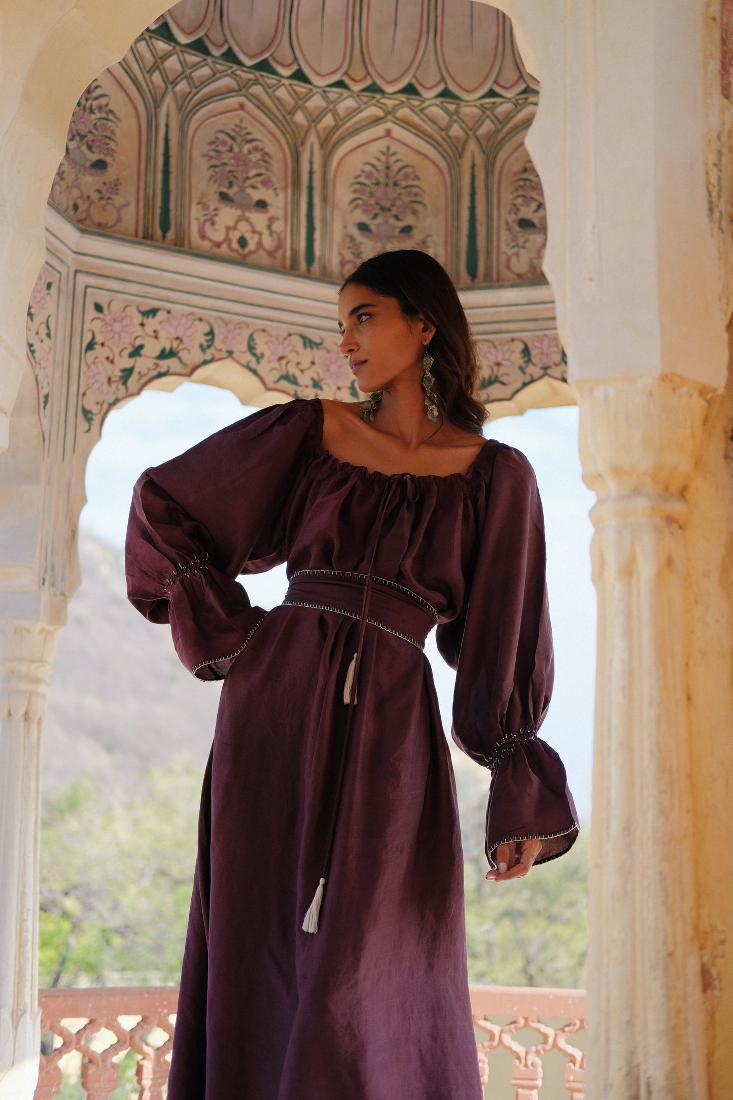 
                  
                    ZAZI Vayana Dress in handwoven Mulberry silk featuring a bohemian maxi silhouette, hand-embroidered details, versatile off-shoulder neckline, long sleeves, and matching belt.
                  
                