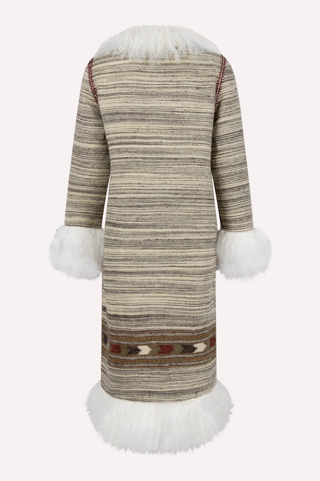 
                  
                    Handmade winter coat crafted from 100% pure Himalayan wool by Kullvi Whims artisans in India.
                  
                