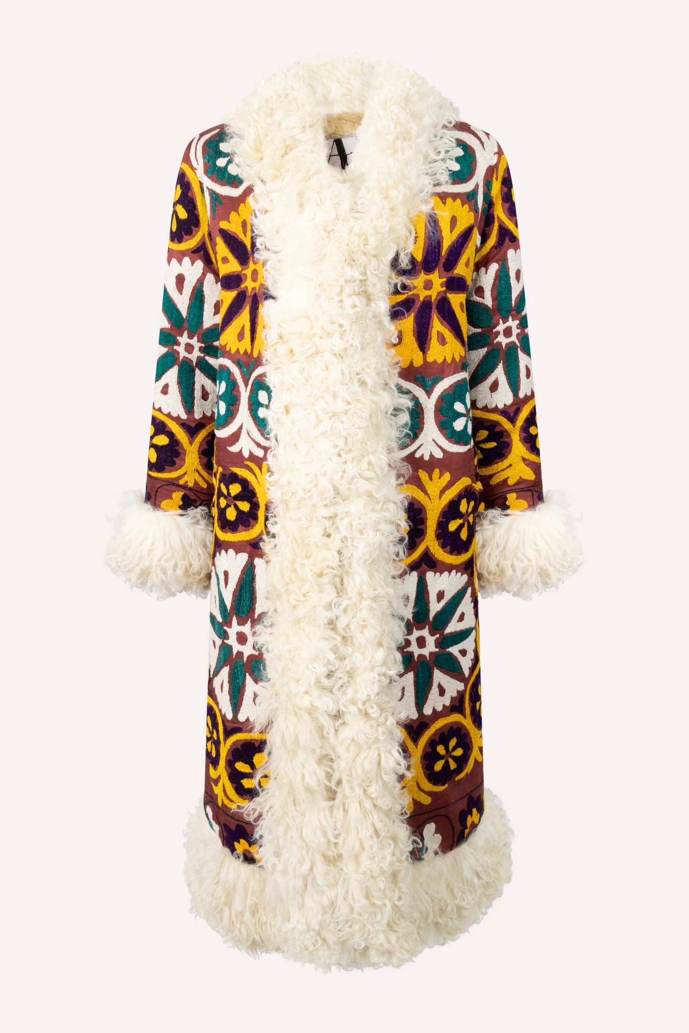 Handcrafted ZAZI Afghan straight coat made from hand-embroidered vintage cotton suzani, featuring a 70s Penny Lane–inspired silhouette, hook closure, colorful floral patterns, and up-cycled sheepskin lining.