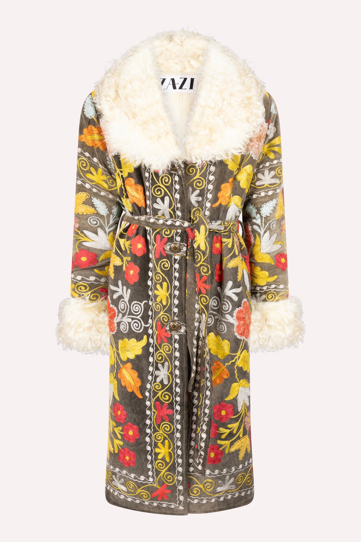 Handcrafted ZAZI Afghan coat made from vintage cotton suzani embroidery, featuring a 70s Penny Lane silhouette, belted waist, colorful floral patterns, and up-cycled sheepskin lining.