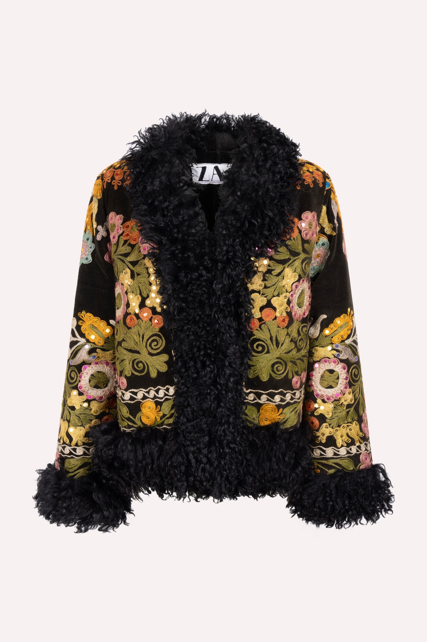 Short ZAZI Afghan coat handcrafted from vintage velours cotton suzani embroidery with upcycled sheepskin lining, featuring a straight 1970s-inspired silhouette with hook closures, made by women artisans in Afghanistan.