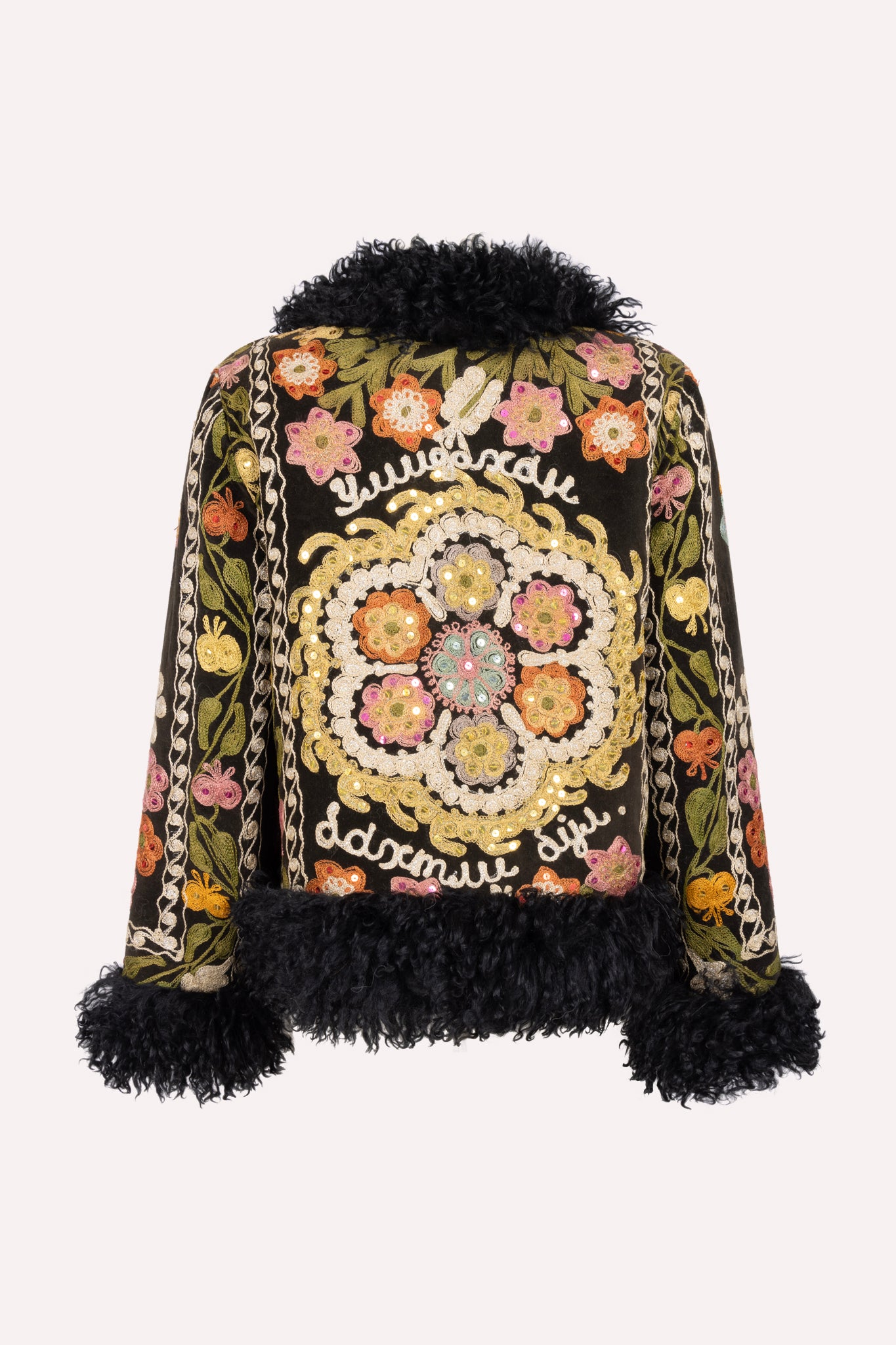 Short ZAZI Afghan coat handcrafted from vintage velours cotton suzani embroidery with upcycled sheepskin lining, featuring a straight 1970s-inspired silhouette with hook closures, made by women artisans in Afghanistan.