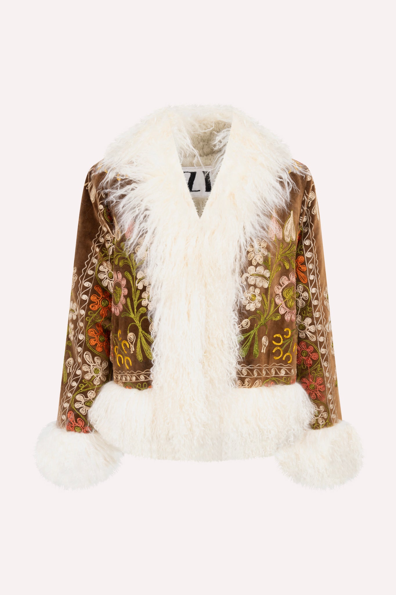 Short ZAZI Afghan coat handcrafted from vintage velours cotton suzani embroidery with upcycled sheepskin lining, featuring a straight 1970s-inspired silhouette with hook closures, made by women artisans in Afghanistan.