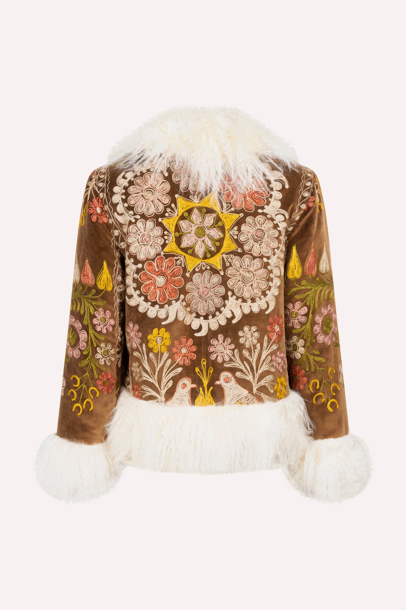 Short ZAZI Afghan coat handcrafted from vintage velours cotton suzani embroidery with upcycled sheepskin lining, featuring a straight 1970s-inspired silhouette with hook closures, made by women artisans in Afghanistan.