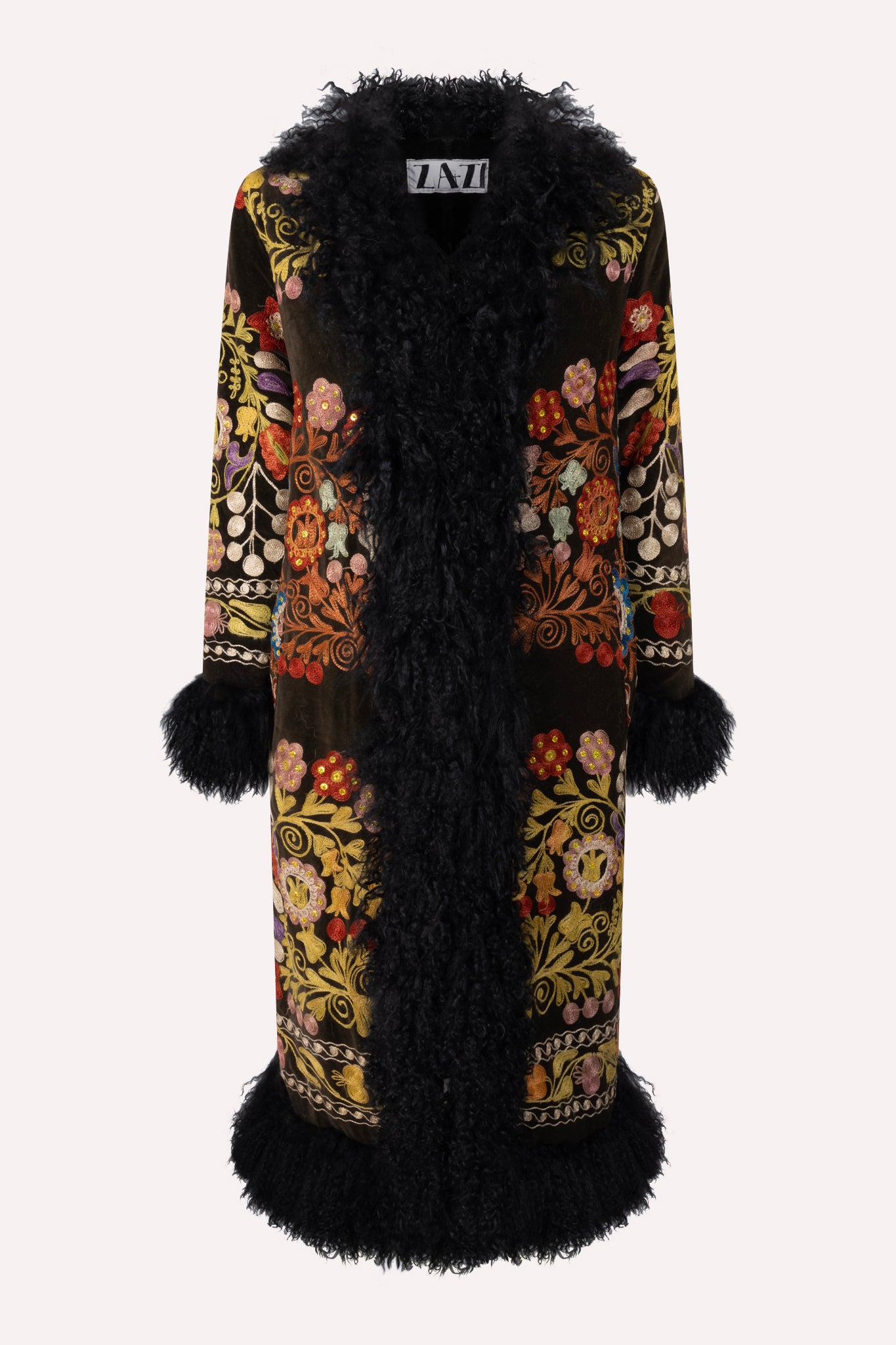 Handcrafted ZAZI Afghan coat made from vintage cotton suzani embroidery with upcycled sheepskin lining, featuring a straight 1970s-inspired silhouette with hook closures, created by women artisans in Afghanistan.