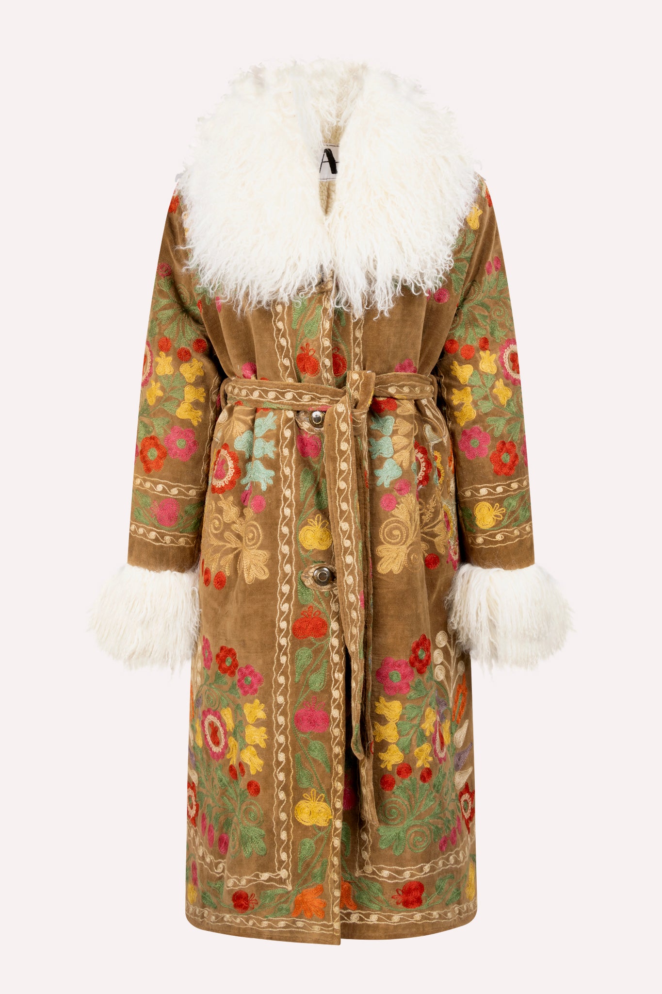 Handcrafted ZAZI Afghan coat featuring vintage cotton suzani embroidery and upcycled shearling lining, inspired by a 1970s Penny Lane silhouette and made by women artisans in Afghanistan.