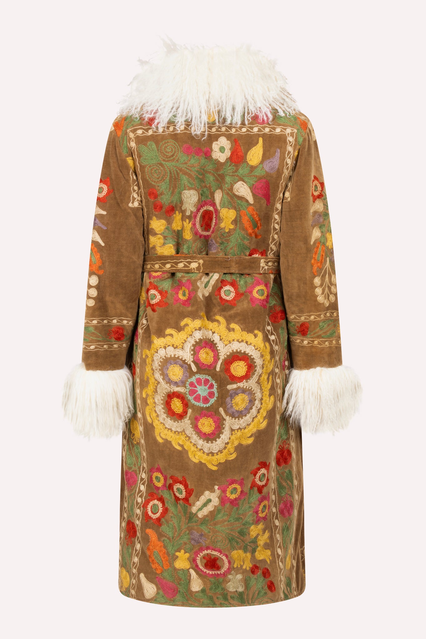 Handcrafted ZAZI Afghan coat featuring vintage cotton suzani embroidery and upcycled shearling lining, inspired by a 1970s Penny Lane silhouette and made by women artisans in Afghanistan.