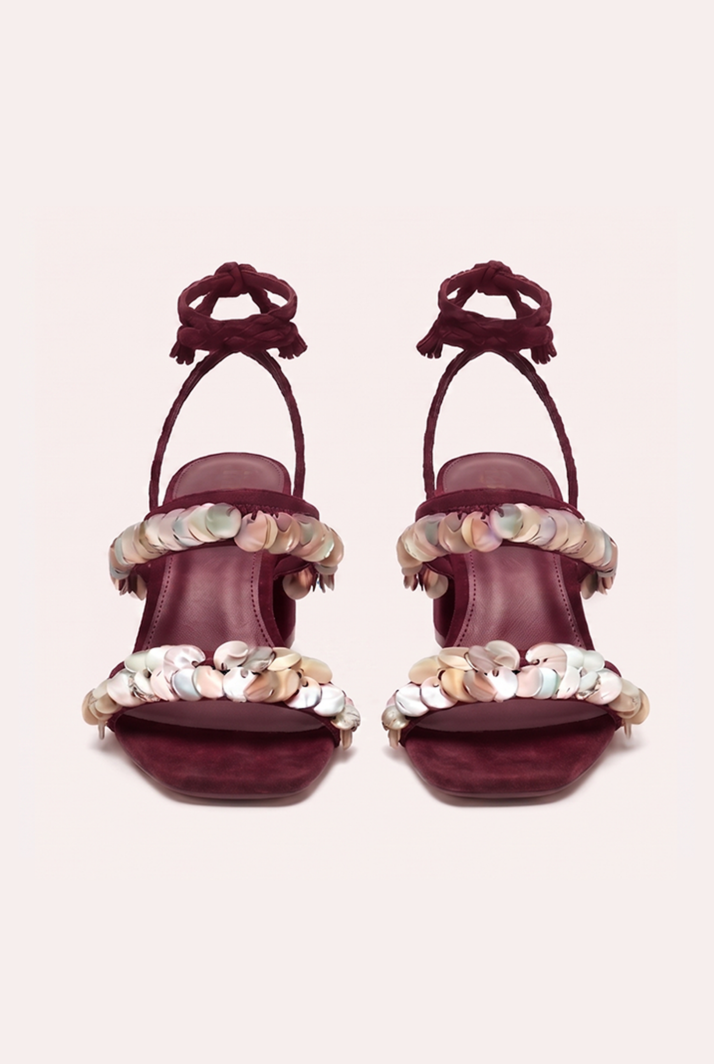 Handcrafted burgundy suede heel sandals with mother of pearl beads and braided wrap-around ankle ties.