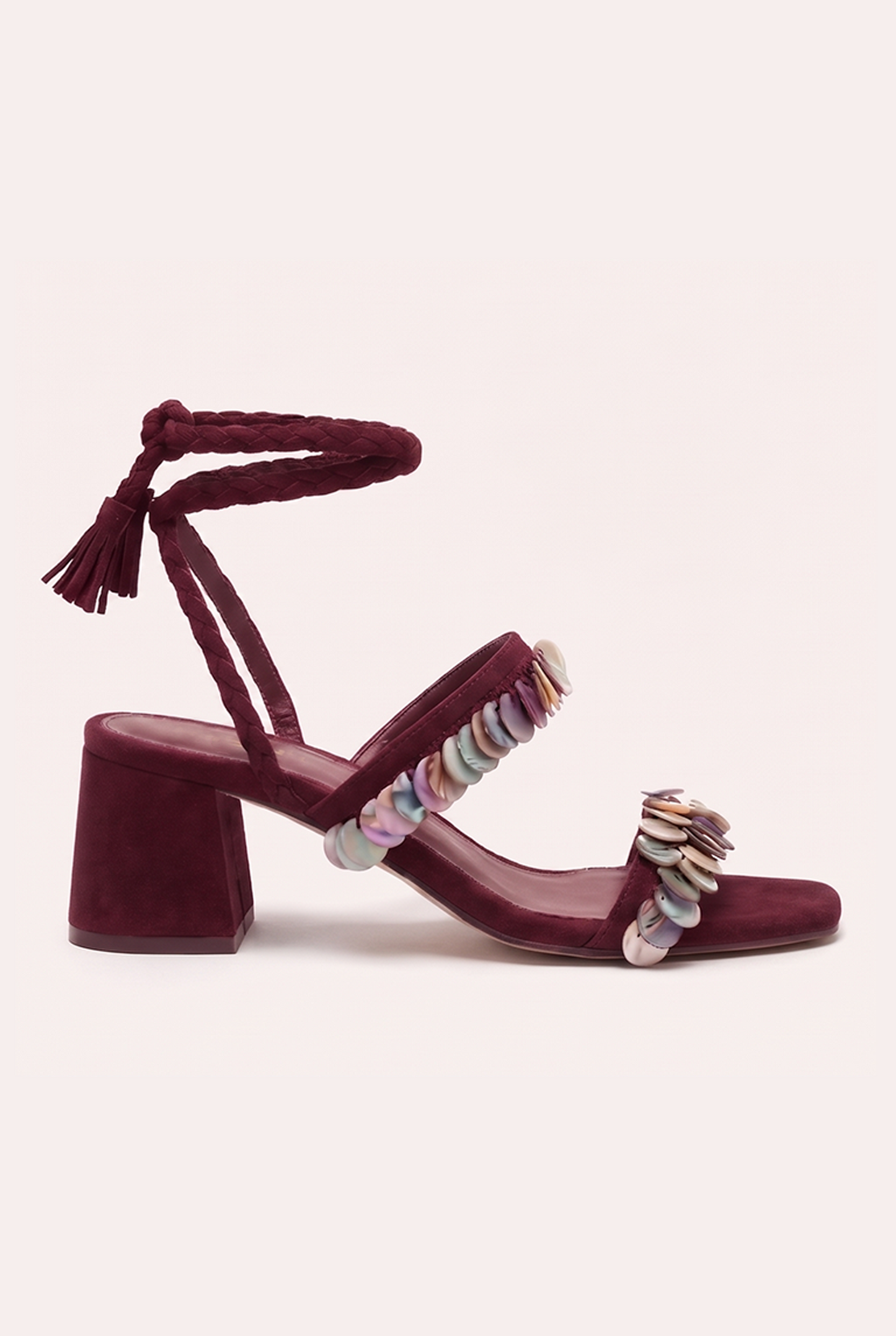 Handcrafted burgundy suede heel sandals with mother of pearl beads and braided wrap-around ankle ties.