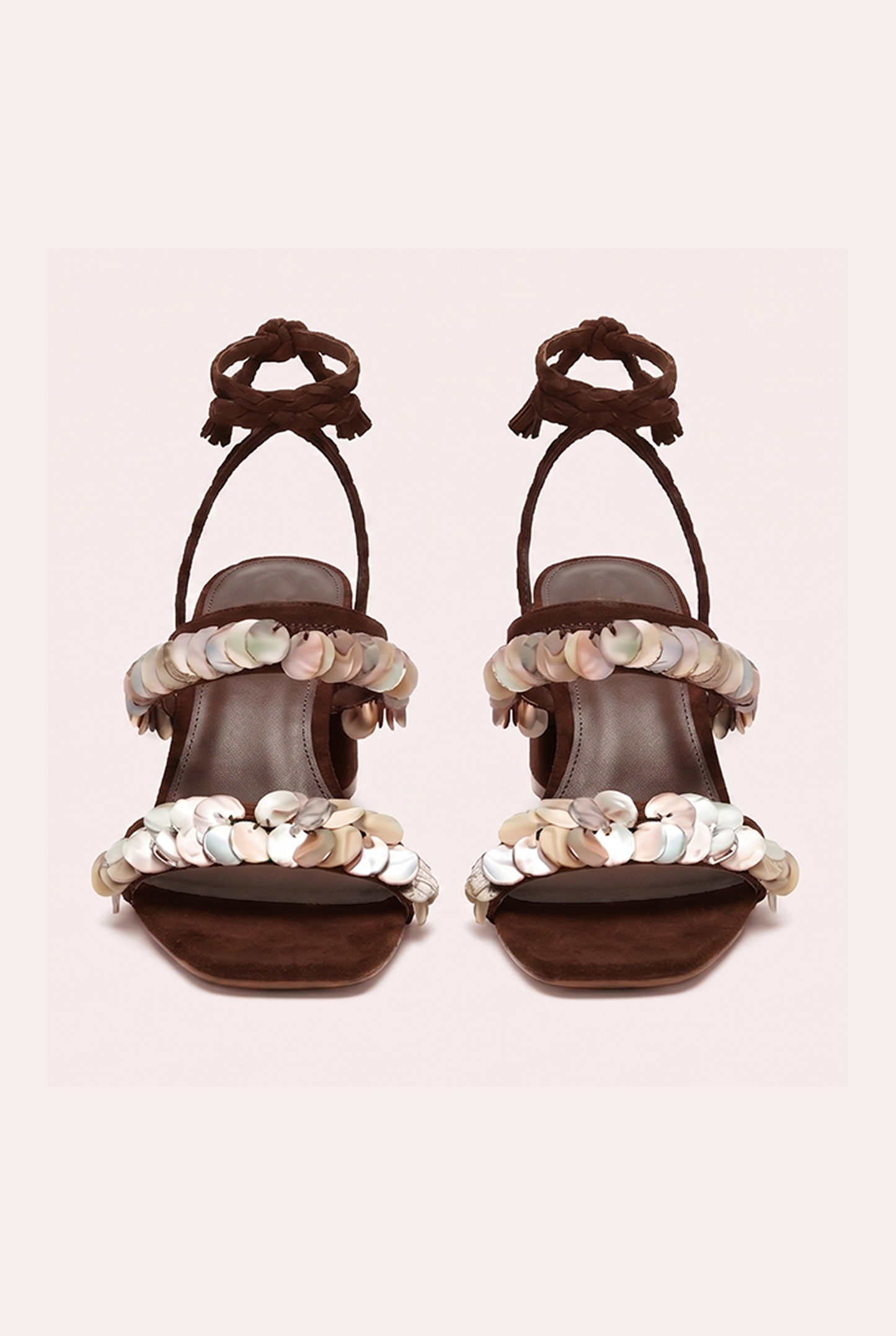 Handcrafted chocolate suede heel sandals with mother of pearl beads and braided wrap-around ankle ties.