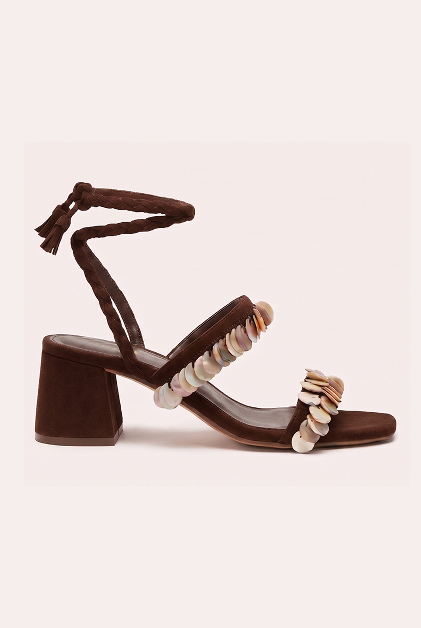 Handcrafted chocolate suede heel sandals with mother of pearl beads and braided wrap-around ankle ties.