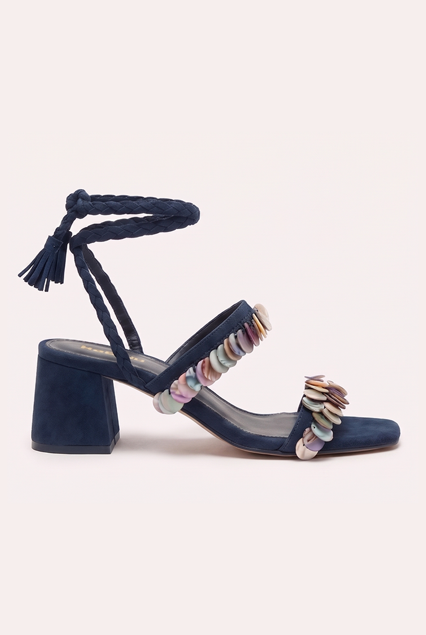 Handcrafted dark blue suede heel sandals with mother of pearl beads and braided wrap-around ankle ties.