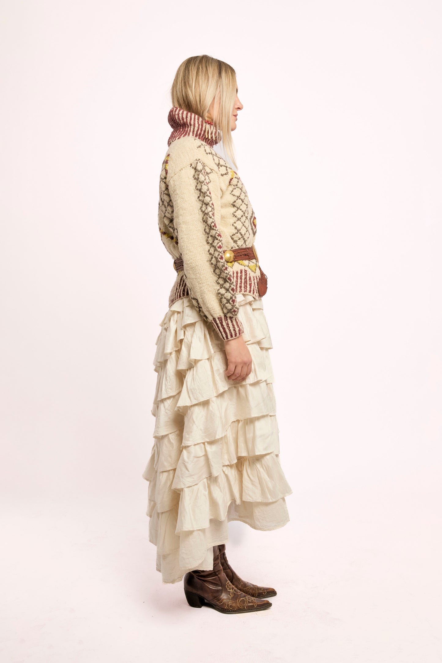 
                  
                    Handcrafted Himalayan wool jumper with puffed sleeves, turtleneck, and ribbed detailing, naturally dyed and handmade by female artisans in India.
                  
                