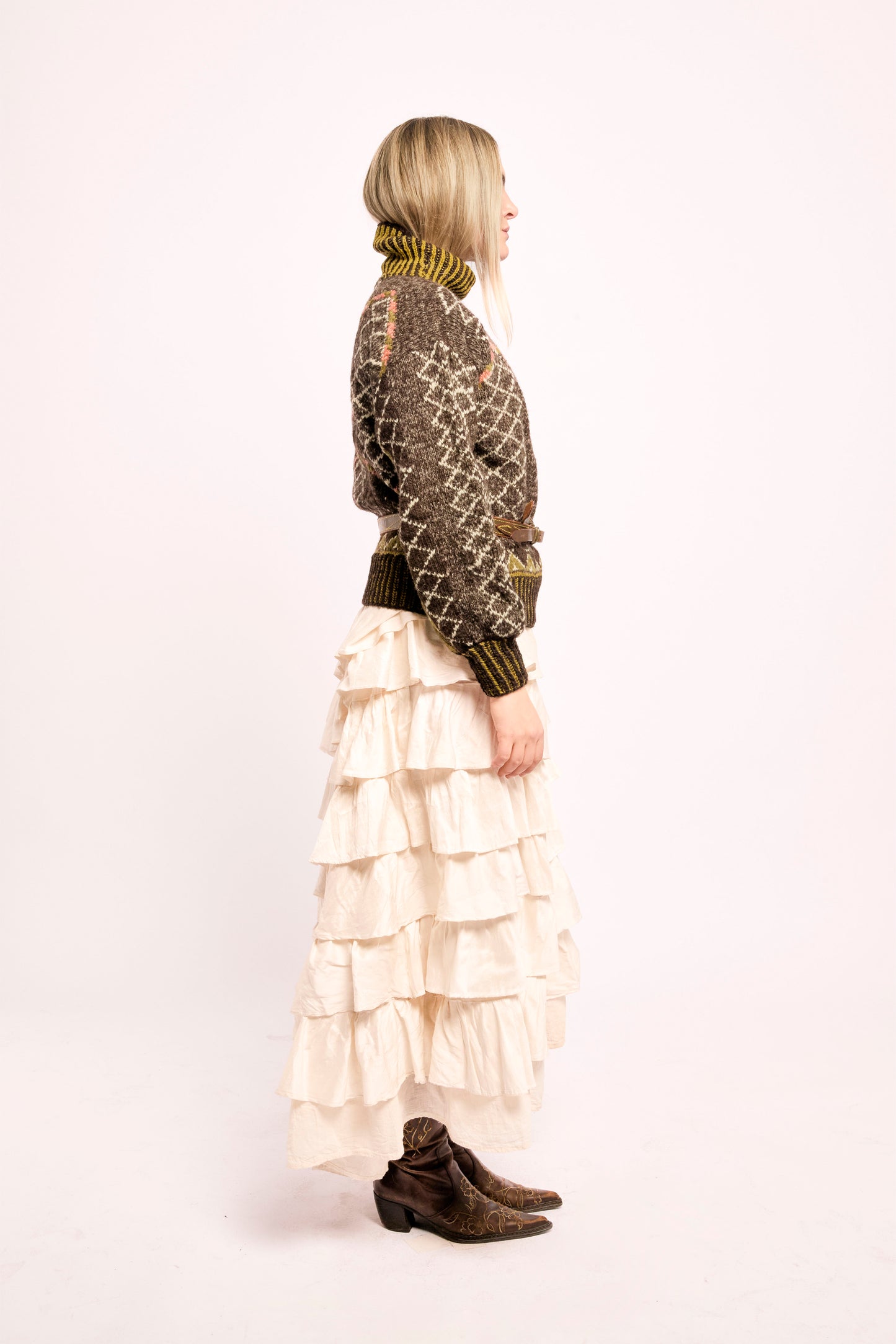 
                  
                    Handcrafted Himalayan wool jumper with puffed sleeves, turtleneck, and ribbed detailing, naturally dyed and handmade by female artisans in India.
                  
                