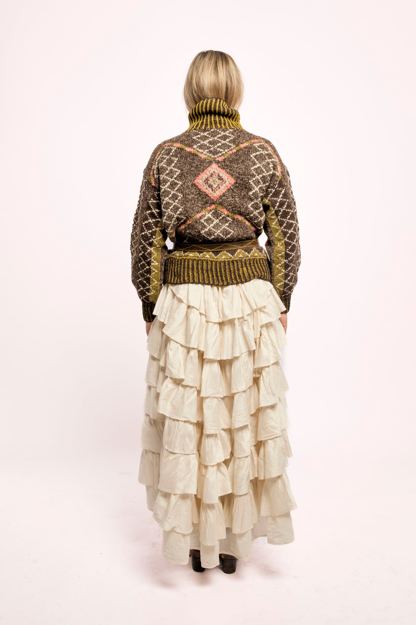 
                  
                    Handcrafted Himalayan wool jumper with puffed sleeves, turtleneck, and ribbed detailing, naturally dyed and handmade by female artisans in India.
                  
                