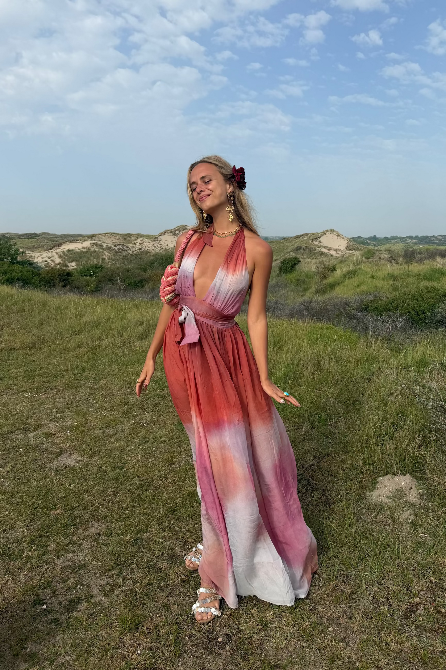 ZAZI Holiya hand-dyed maxi dress with halter neckline, flowing silhouette, and sunset-inspired watercolor hues, handcrafted in India by Heenaagrima artisans.