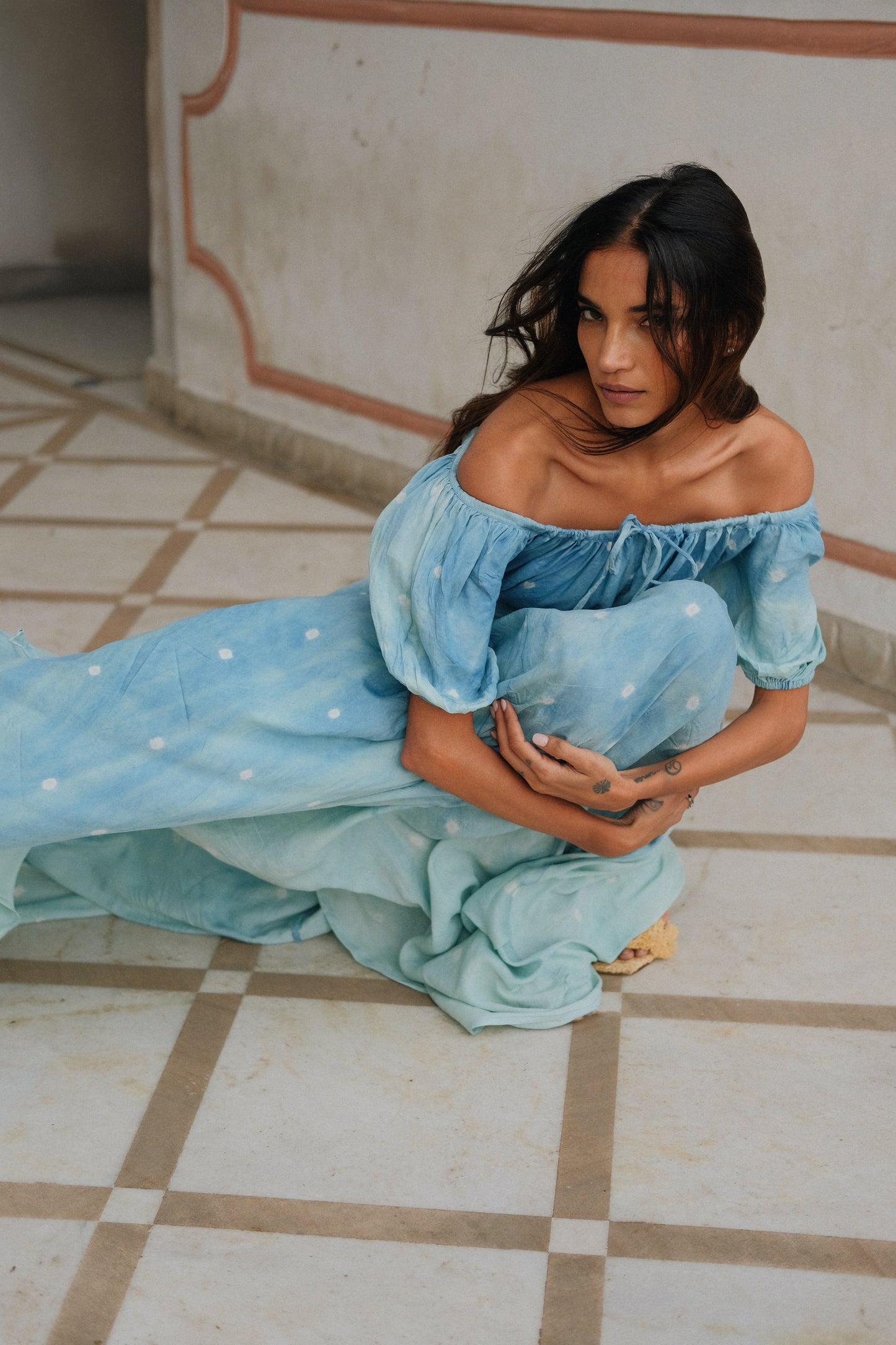 
                  
                    ZAZI Pathani Dress featuring a naturally dyed and eco-printed off-shoulder maxi silhouette with a flowing bohemian design and artisan craftsmanship.
                  
                
