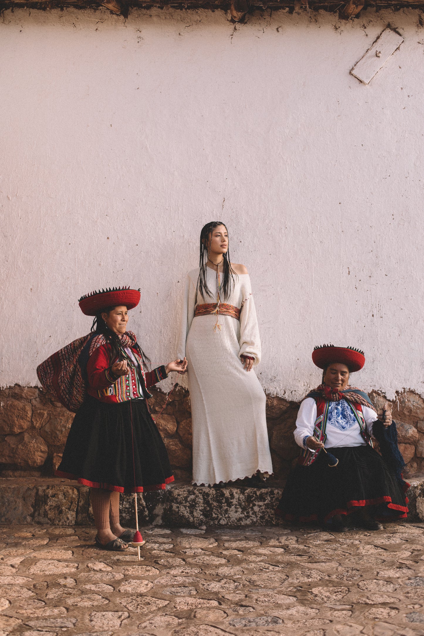 
                  
                    Handcrafted Peruvian alpaca wool maxi dress with crochet details, balloon sleeves, unique contrasting shoulder accent, and waist-accentuating belt.
                  
                
